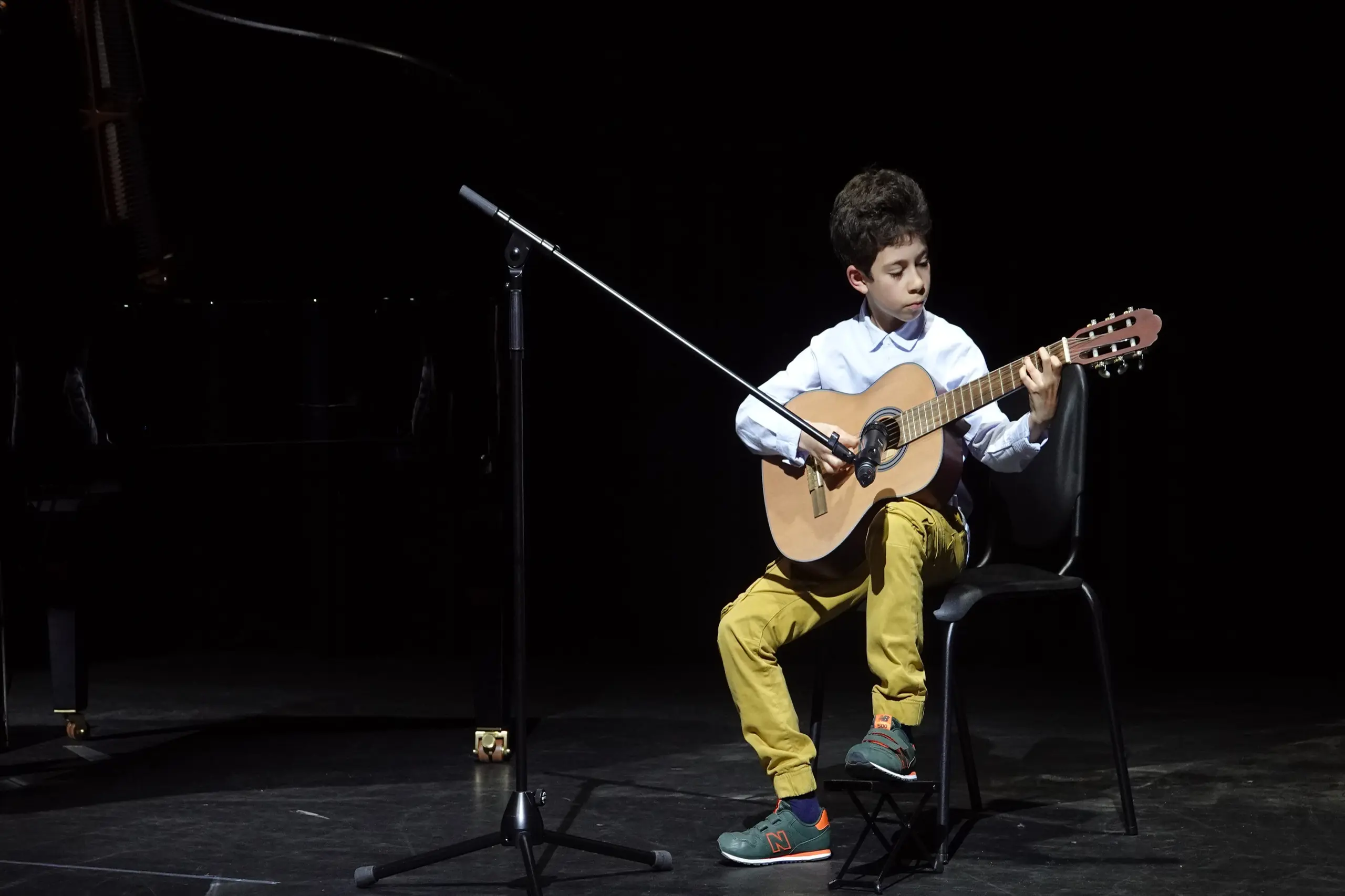 Student playing guitar